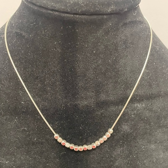 Jewelry - Necklace with small gold and silver tone beads.